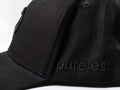 pureest Keps. Broderad logo i svart & svart tyg